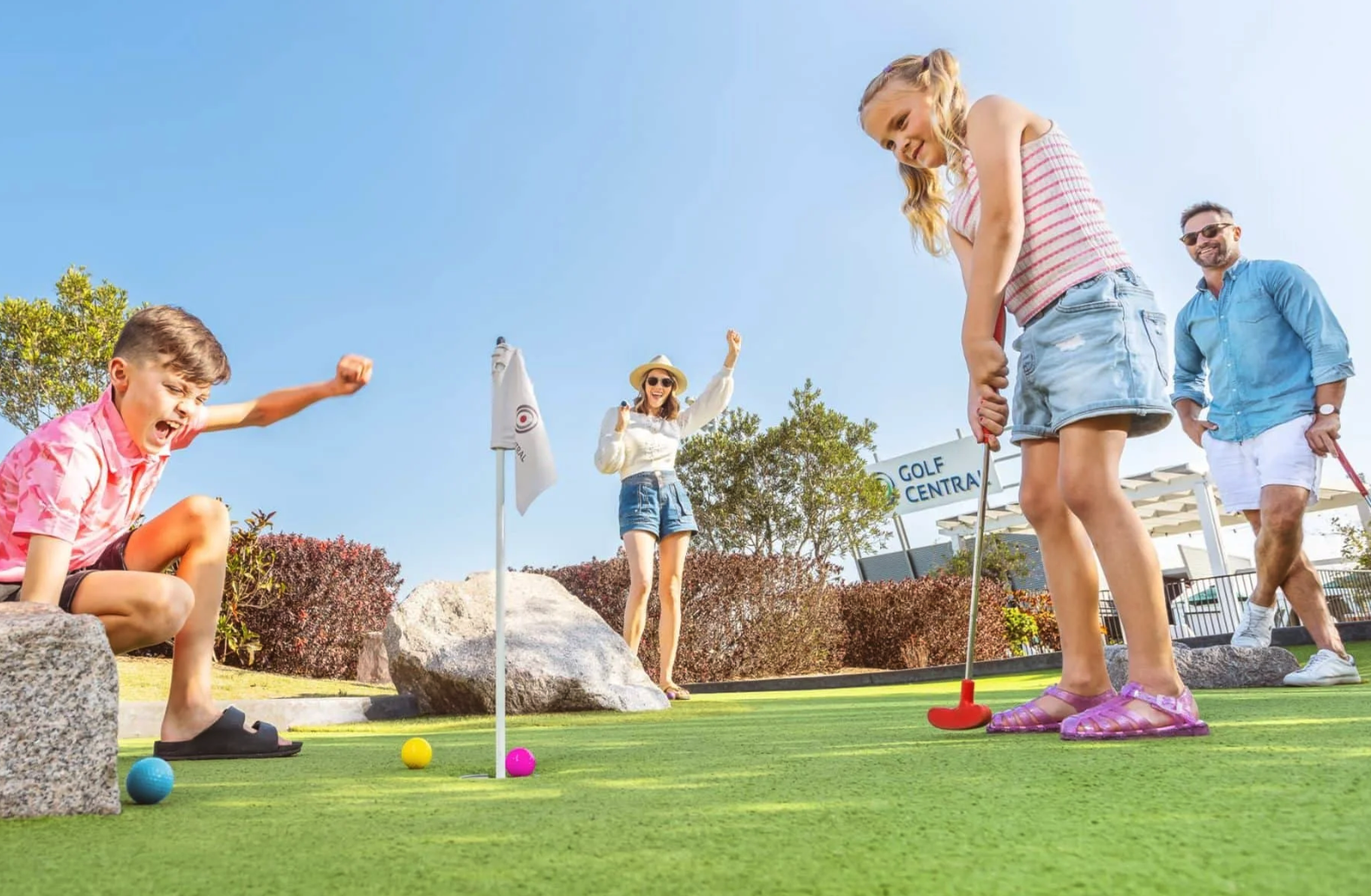 Children playing mini golf at a birthday party